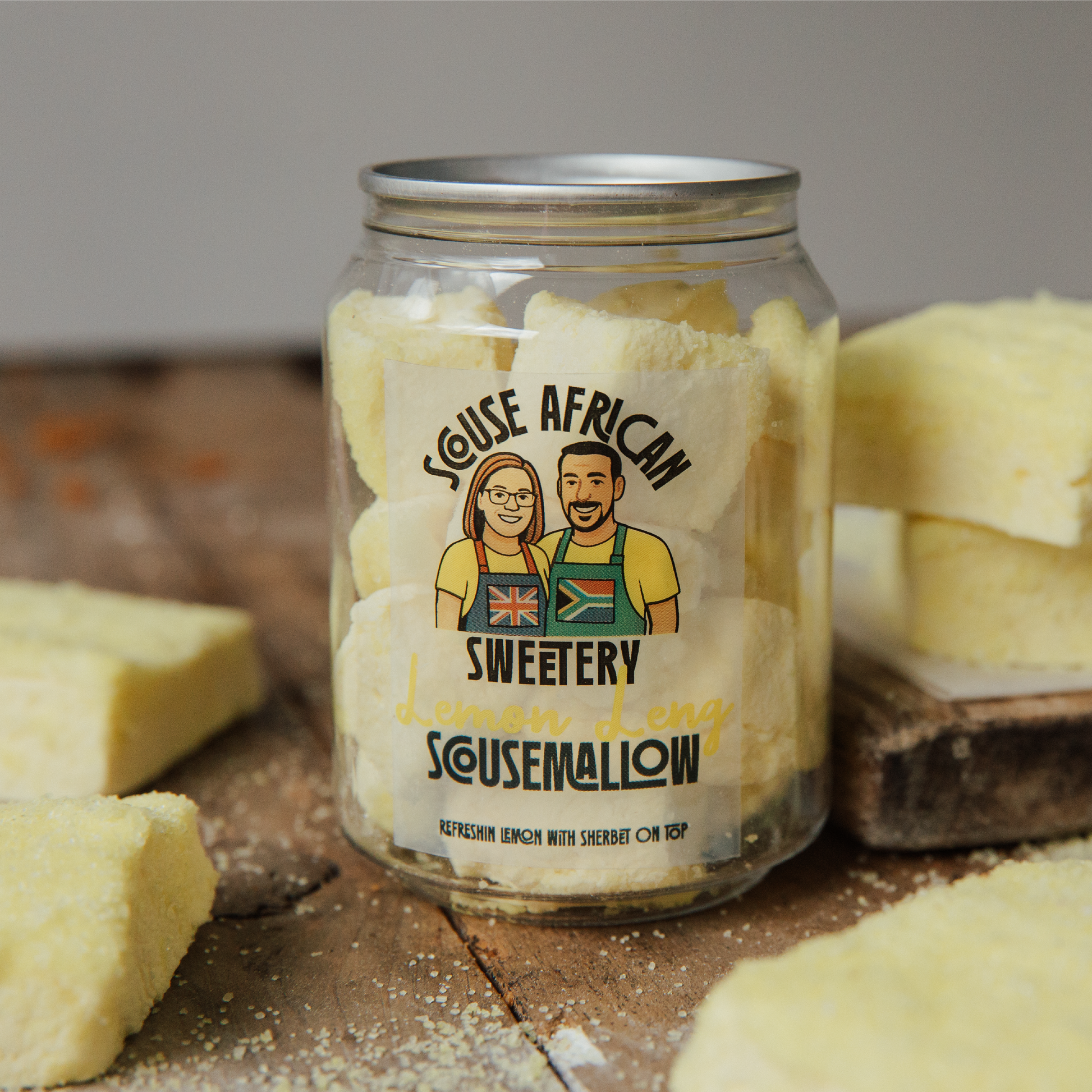 Jar of 'Souse African' Sweetery Sousemallow with cartoon characters on a wooden surface.