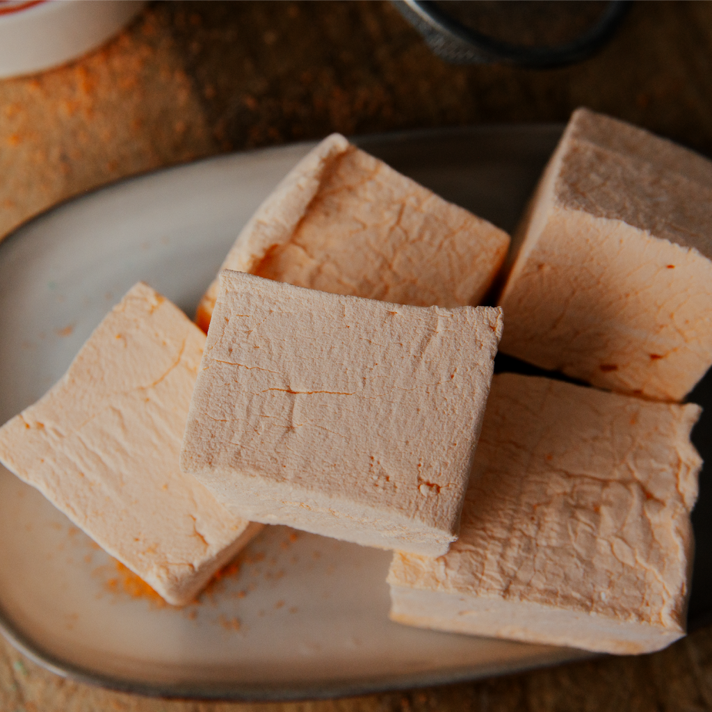 Slices of marshmallow on a plate with a blurred background